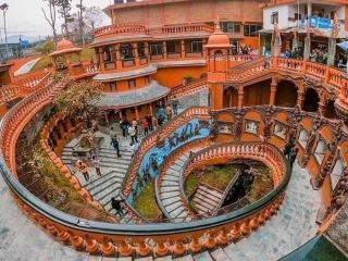 Tourists visiting spiral staircase at Manakamana Temple in Nepal